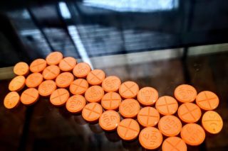 orange round medication pill lot