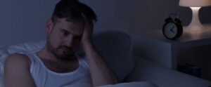 man suffering from insomnia