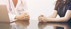Doctor and patient consulting on a table