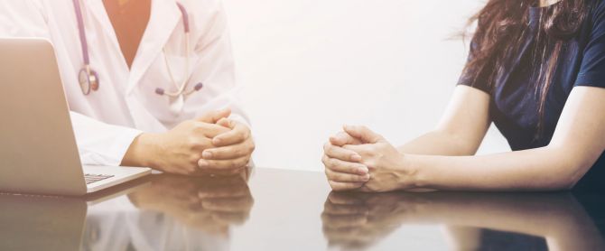 Doctor and patient consulting on a table