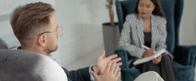 man interviewed by a woman