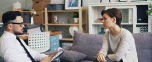 therapist consults with a client