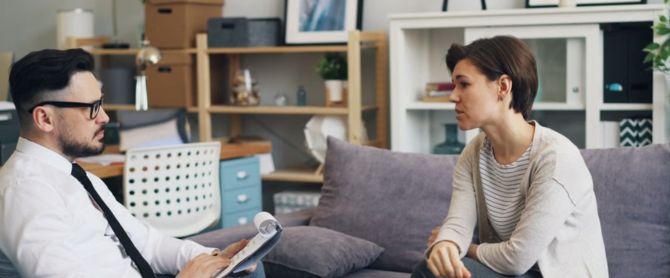 therapist consults with a client