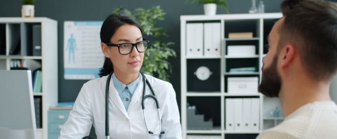 Doctor consults patient in modern clinic setting