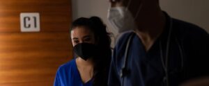 Doctors in scrubs and masks