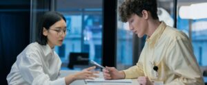 Two professionals discussing at a modern reception