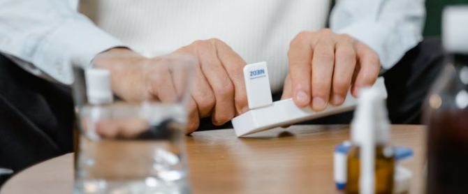 adult preparing medicine doses